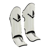 White glossy shin guards pair with V logo and black-edged adjustable straps
