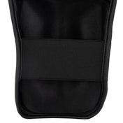 Black shin guard sleeve with textured fabric panel and padded front section.