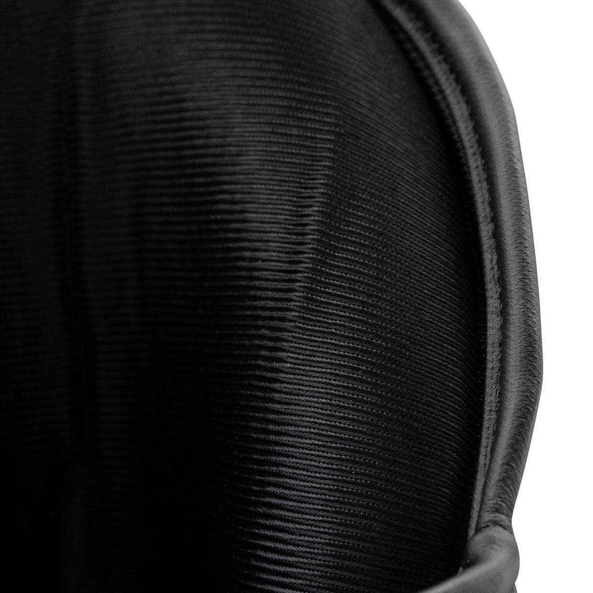 WAKO Valor shin guards, close-up of black textured outer shell surface