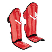 Red shin guards with black trim and white geometric logo on the front.