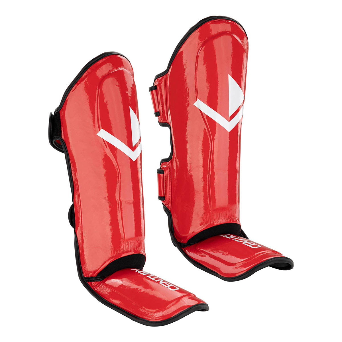 Red protective shin guards with black straps and white emblem on the front.