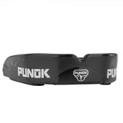 Black mouthguard with Punok branding and central shield emblem