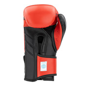 Red and black kickboxing punch glove with black inner wrist padding and WAKO CREED label