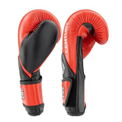 Side view of red and black kickboxing punch gloves with black strap and molded seams