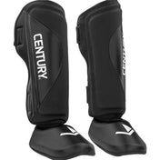 Black shin instep guards, angled view with CENTURY marks and padded ankle guards