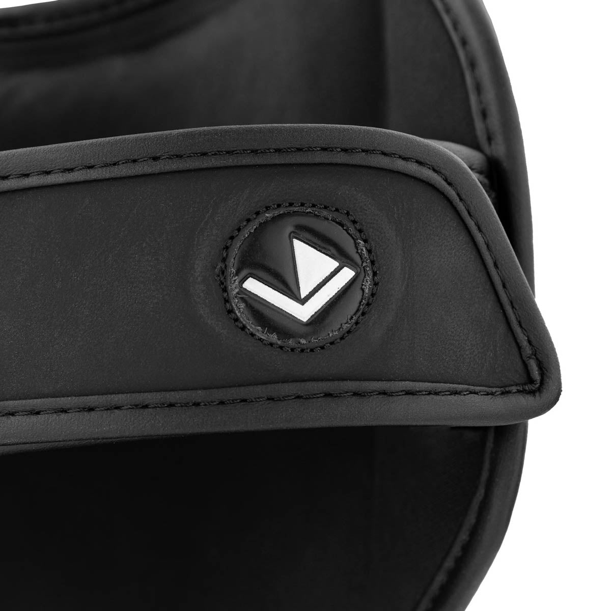 Black shin instep guard shell with stitched emblem and curved padded edge
