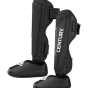 Black shin instep guards with ankle boot-style base and side straps