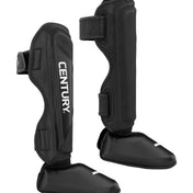Black shin instep guards with reinforced shell and adjustable strap closures