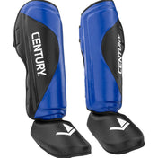 Blue and black shin instep guards with CENTURY side logo and padded ankle guards