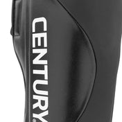 Black shin instep guard showing large white logo on padded protective shell