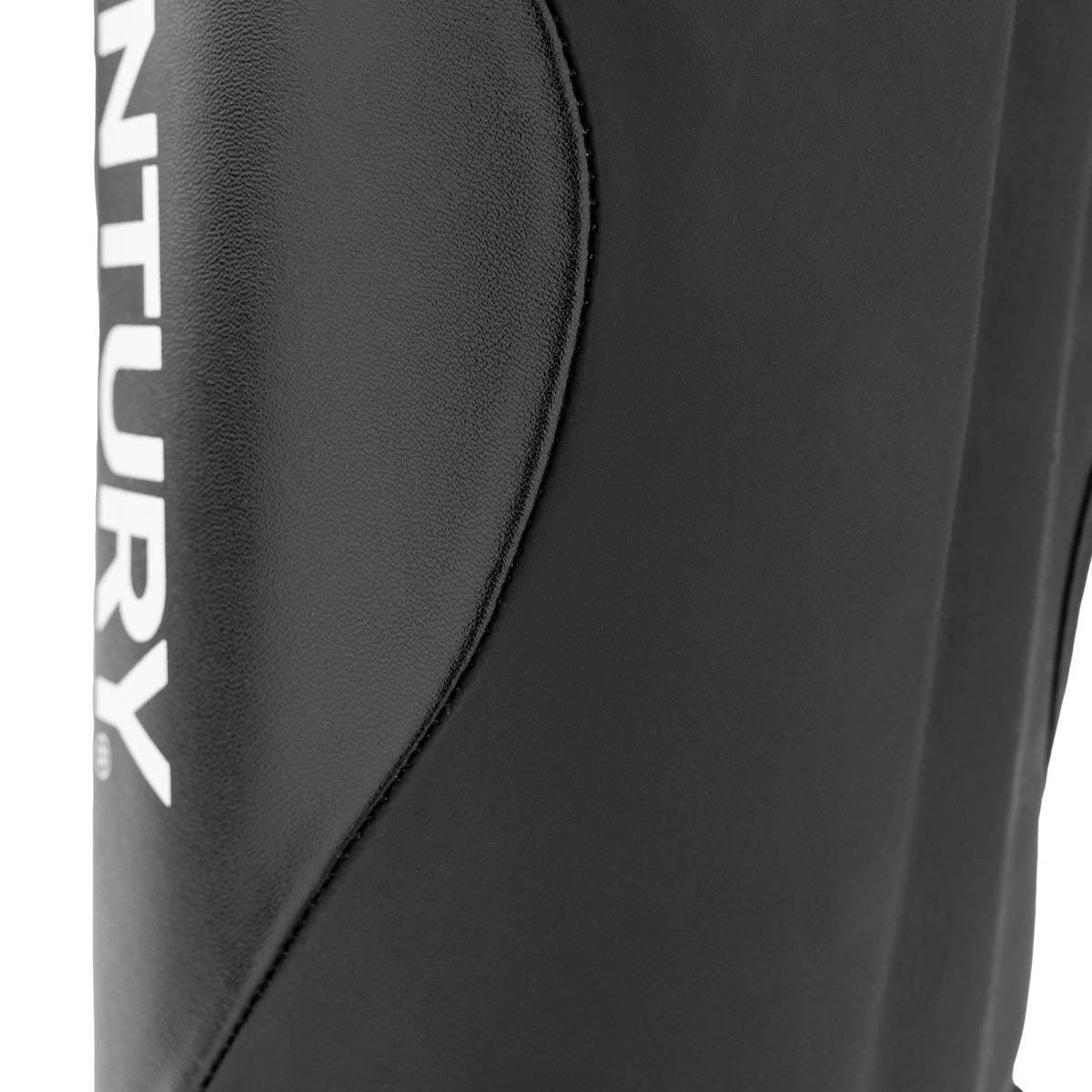 Black shin instep guard close-up of curved protective panel and seam detail