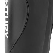 Black shin instep guard close-up of curved protective panel and seam detail