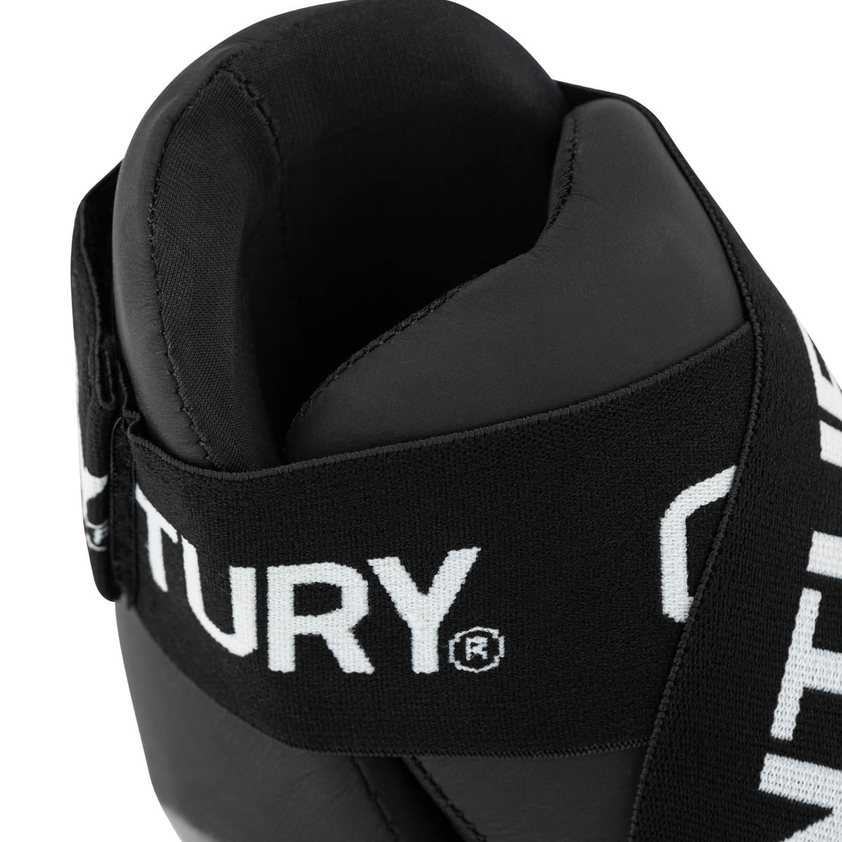 Black kicks with 'CENTURY' ankle strap and padded collar