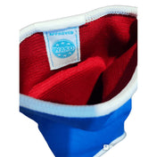 Reversible elbow protector interior, red lining with stitched label and blue outer trim