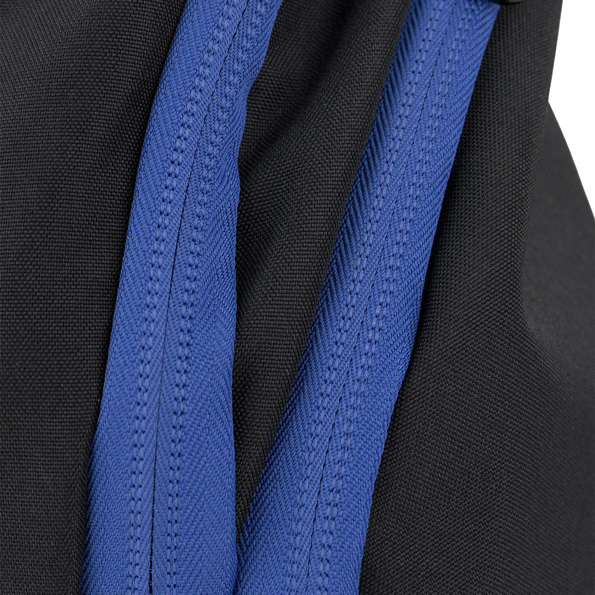 Close-up of blue padded shoulder straps on a black backpack