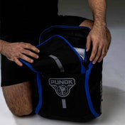 Black backpack with bright blue piping, top handle, and front logo