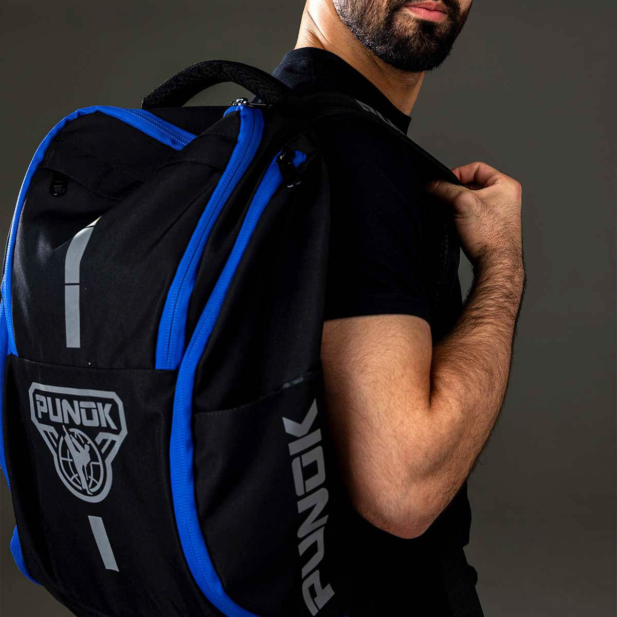 Black backpack with blue zipper and handles, side view with Punok emblem