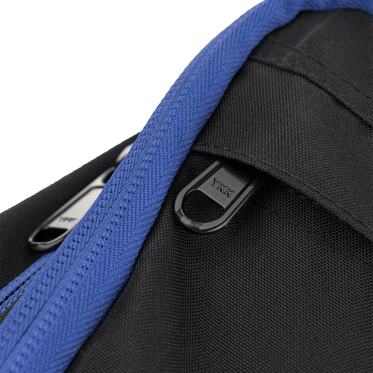Close-up of blue webbing and black zipper pull on a backpack