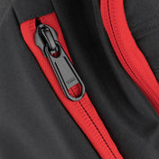 Black and red backpack zipper pocket with black zipper pull detail