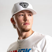 White performance fighter hat worn by a person, featuring the PUNOK front logo.