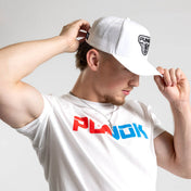 White performance fighter hat being adjusted with PUNOK logo on the front.