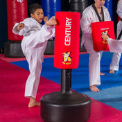 Red freestanding kid kick training dummy with black base, inflatable-style