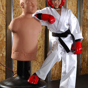 White karate-style gi with black belt, red gloves, and red helmet on a training figure
