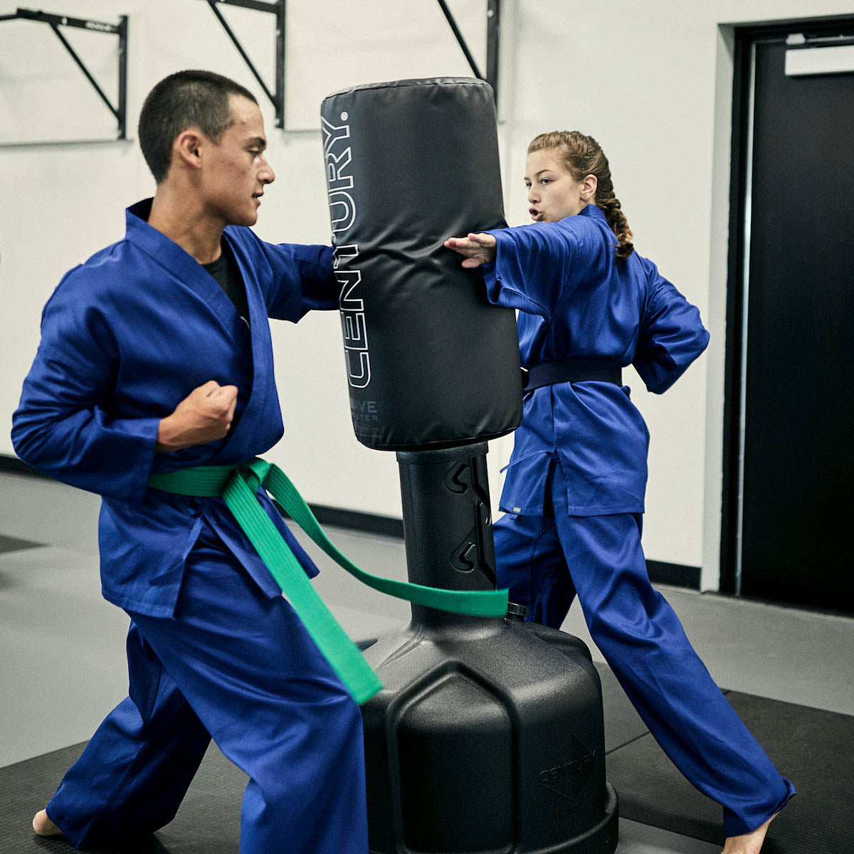 Wavemaster freestanding punch bag with black cylinder and black impact base, handheld training