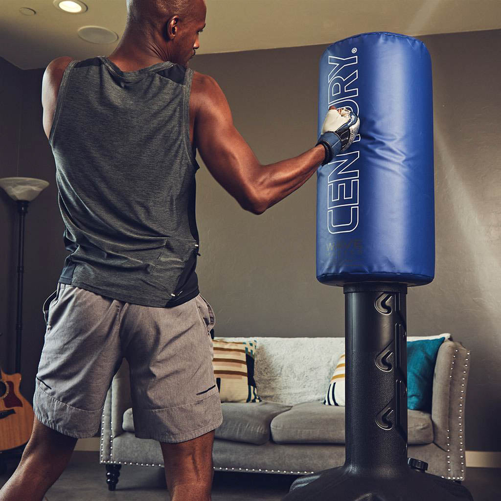 Wavemaster freestanding punch bag with blue padded cylinder and black base, standing drill