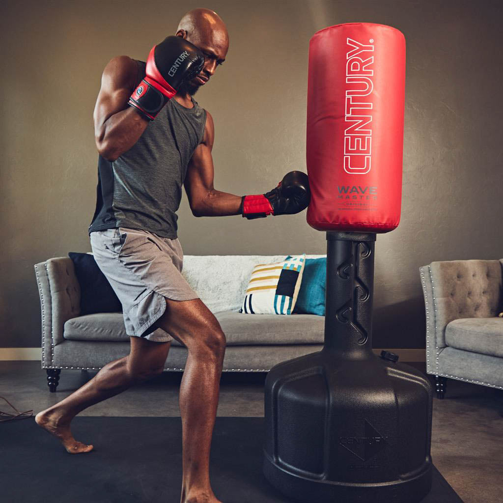 Wavemaster freestanding punching bag with red Century cover and black base