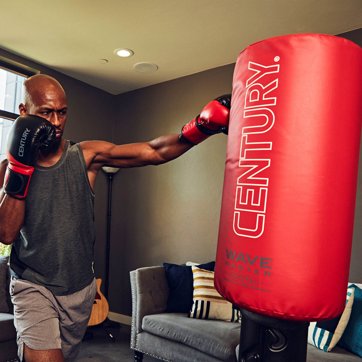 Wavemaster freestanding punching bag with red Century cover and black base