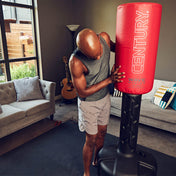 Wavemaster freestanding punching bag with red Century cover and black base