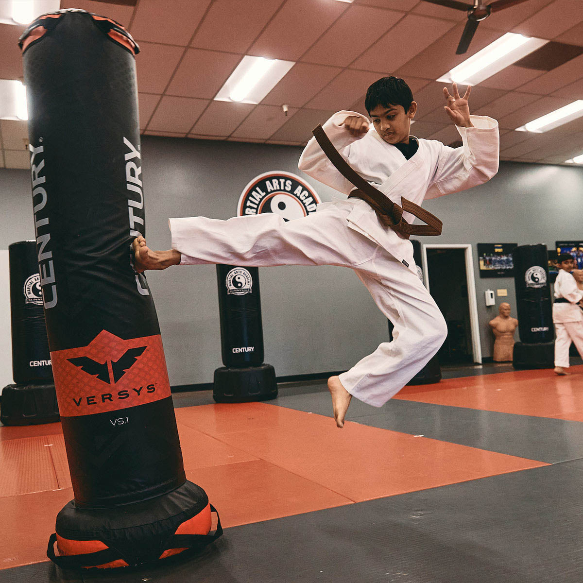 Black Versys VS.1 training bag with red logo and padded top rings, used in training.