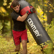 Black Versys VS.1 training bag with red logo, shown outdoors during training.