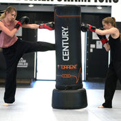 Black freestanding punching bag with Century logo and orange trim