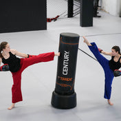 Black freestanding punching bag with orange trim and Century logo, top view