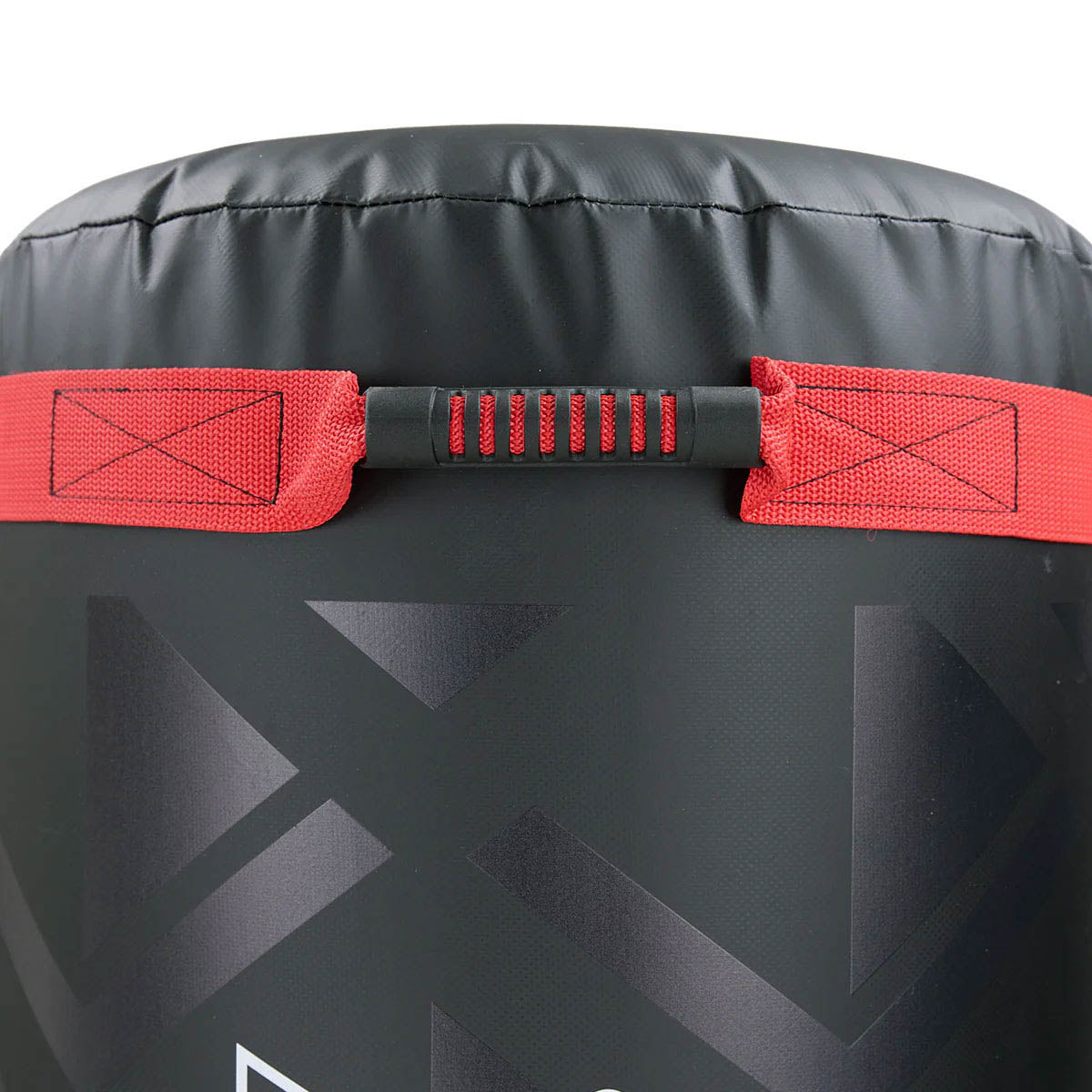 Close-up of black punching bag with red hook-and-loop tie and geometric pattern