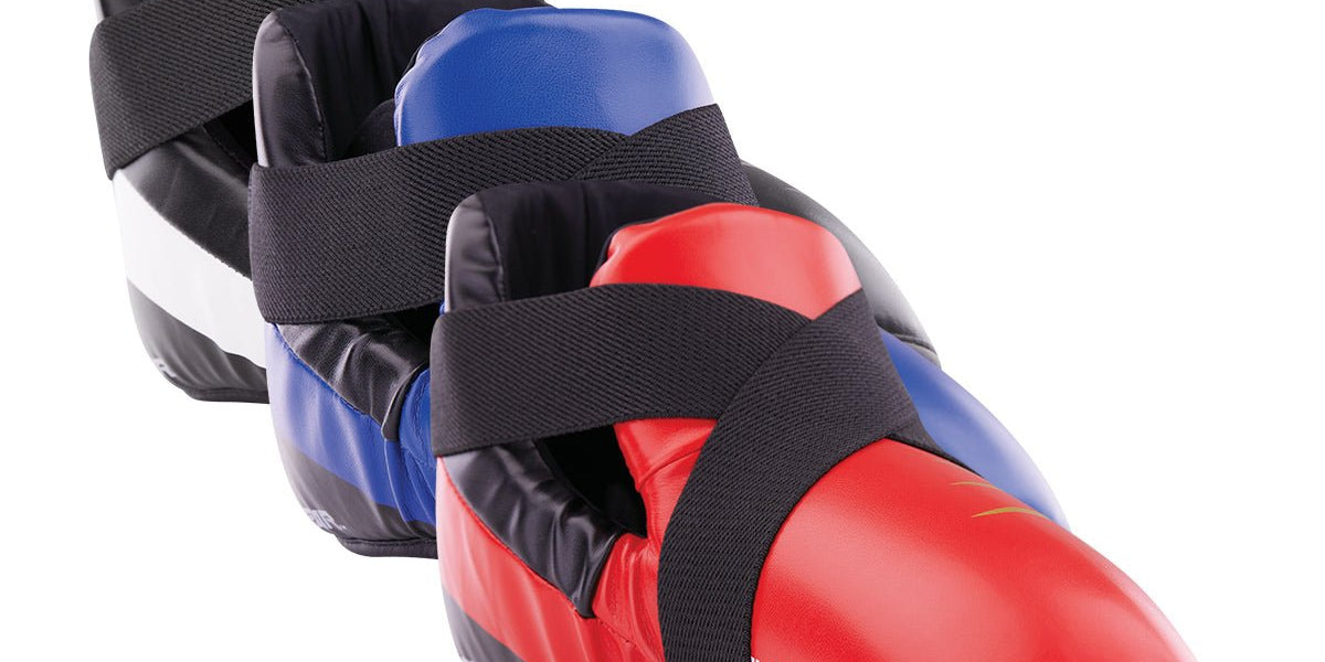 Martial arts kick pad in blue and red with black ankle-strap closure
