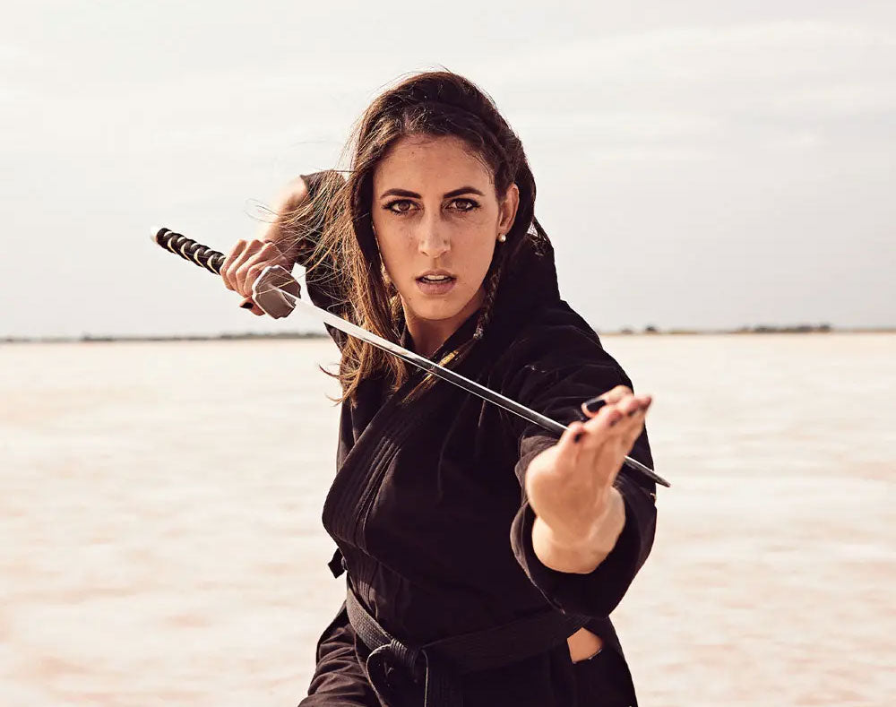 caitlin dechelle posing with sword