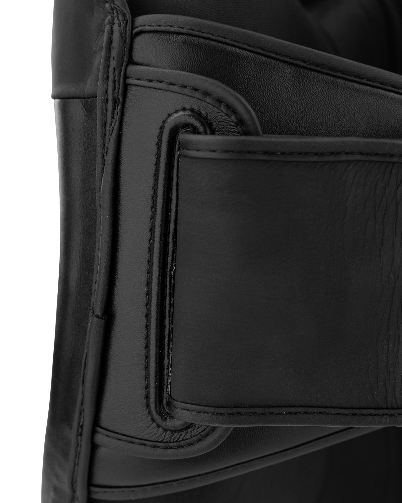 Black leather belly pad edge with stitched trim and inner pocket detail