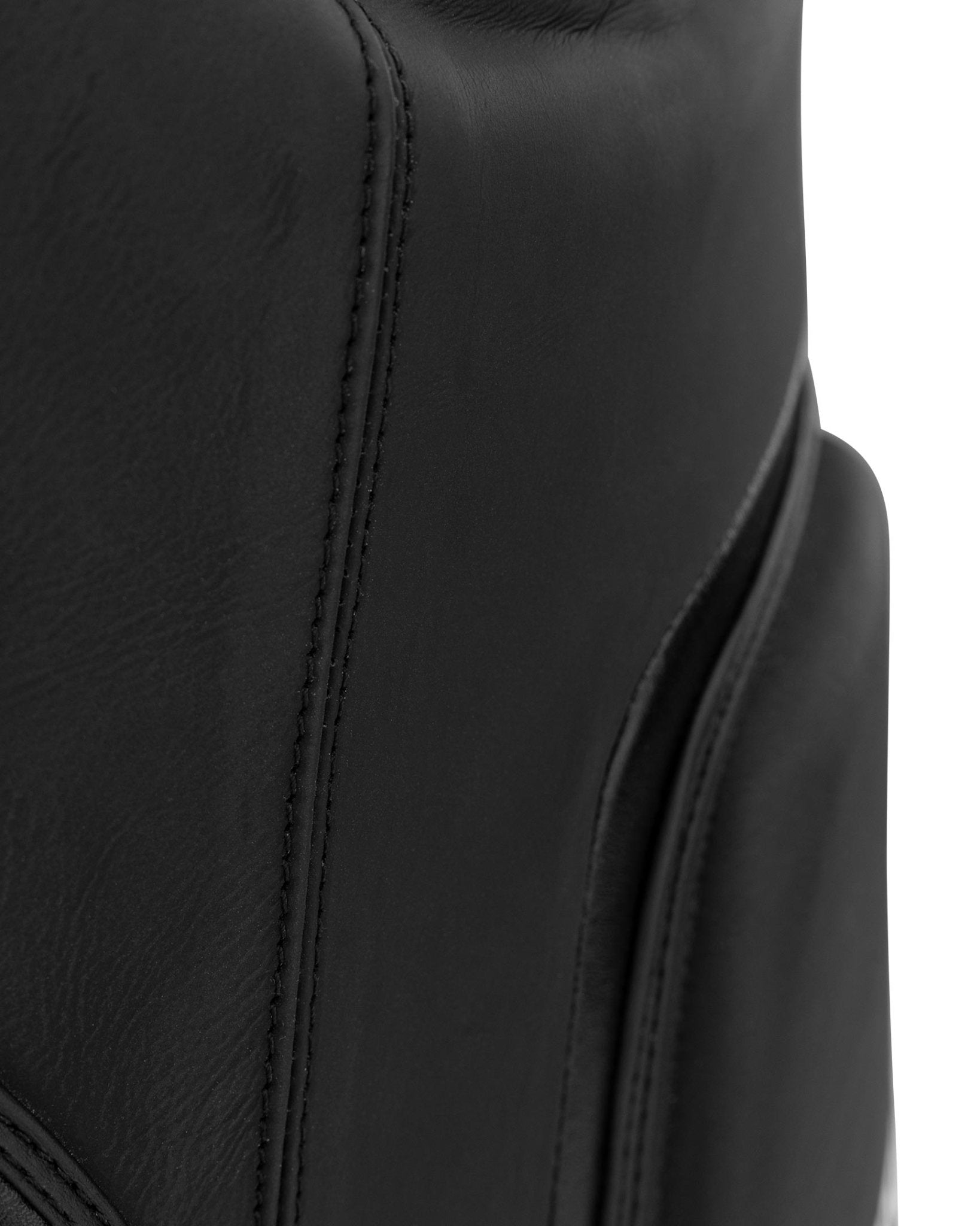 Black belly pad with double-stitched seam and smooth leather panel close-up