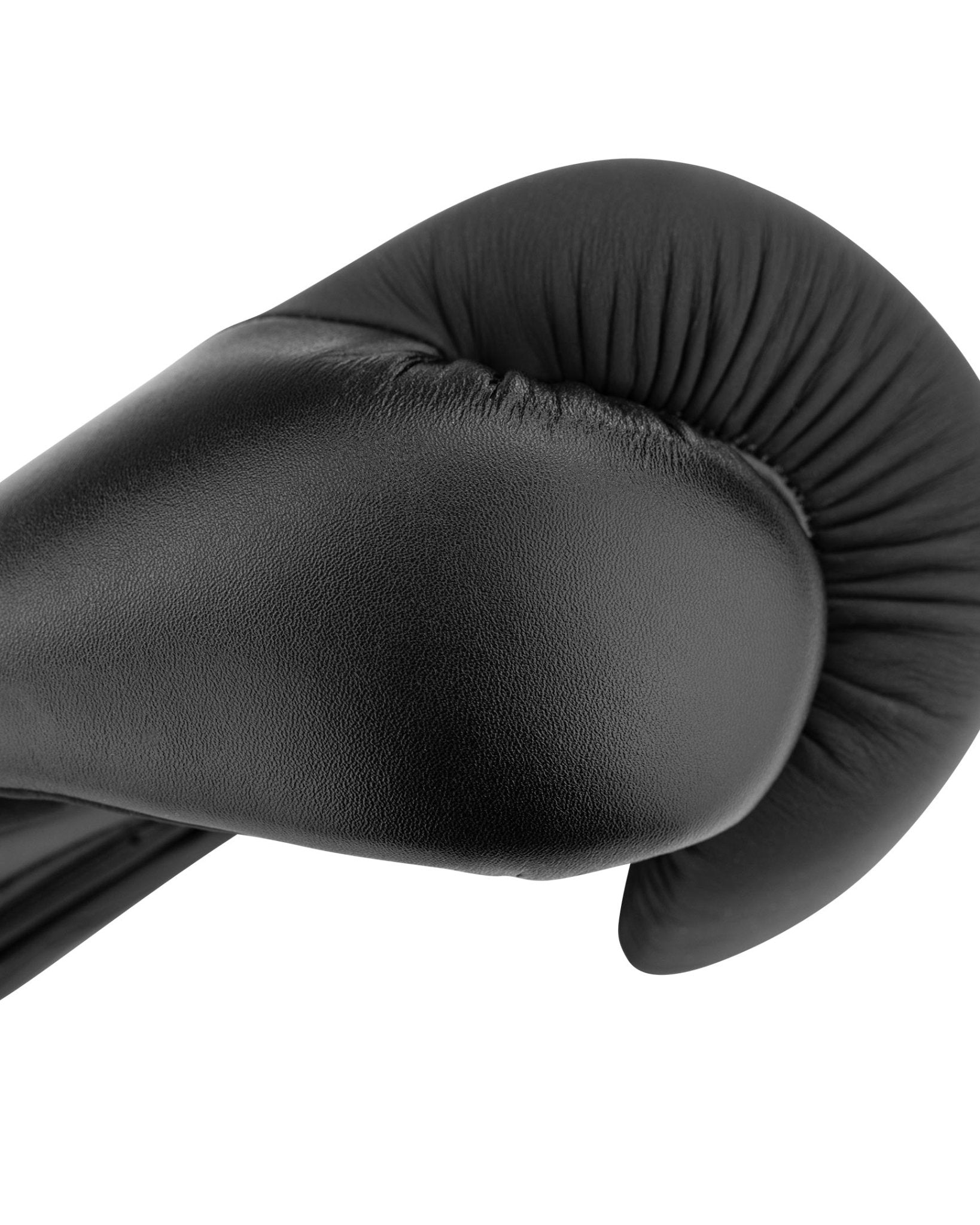 Black boxing glove with padded thumb and curved knuckle