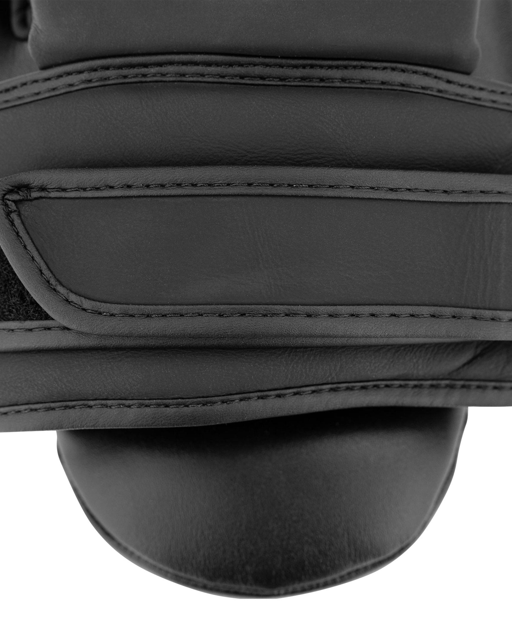 Close-up of black catcher's mitt wrist strap seam with padded leather construction