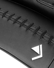 Black Thai pad close-up of stitched lace trim and CENTURY logo arrow marking.