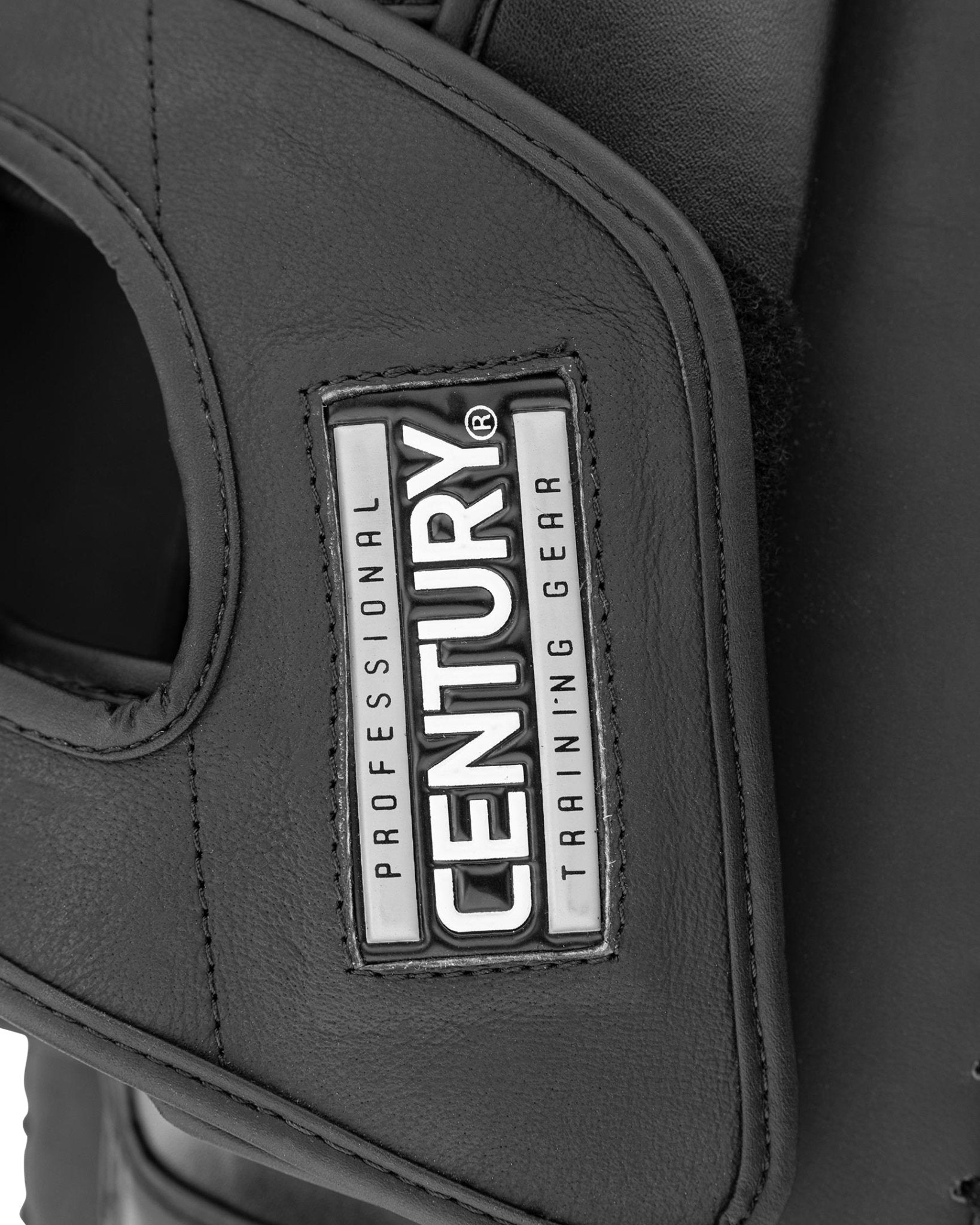 Black Thai pad with CENTURY label on side panel, showing logo patch and stitching.