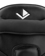 Black Thai focus mitt, top V logo on textured padded surface with curved seam