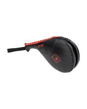 Black Century double target training pad with orange-trimmed seam and wrist strap