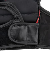 Black boxing glove wrist strap and padded knuckle area