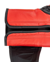 Close-up red boxing glove sleeve with black trim and stitched wrist band