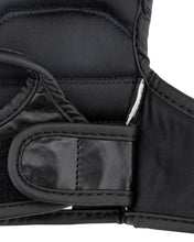 Youth fight gloves close-up: knuckle protection with stitched wrist strap detail
